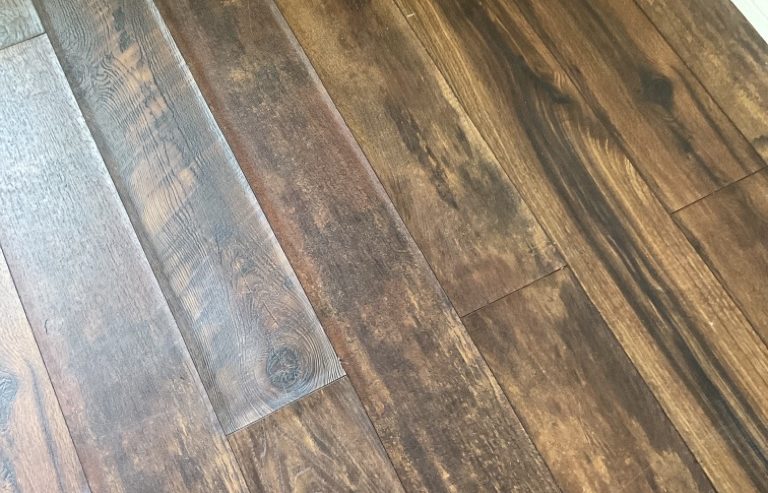 Water Damage Engineered LVP Flooring Requiring Replacement